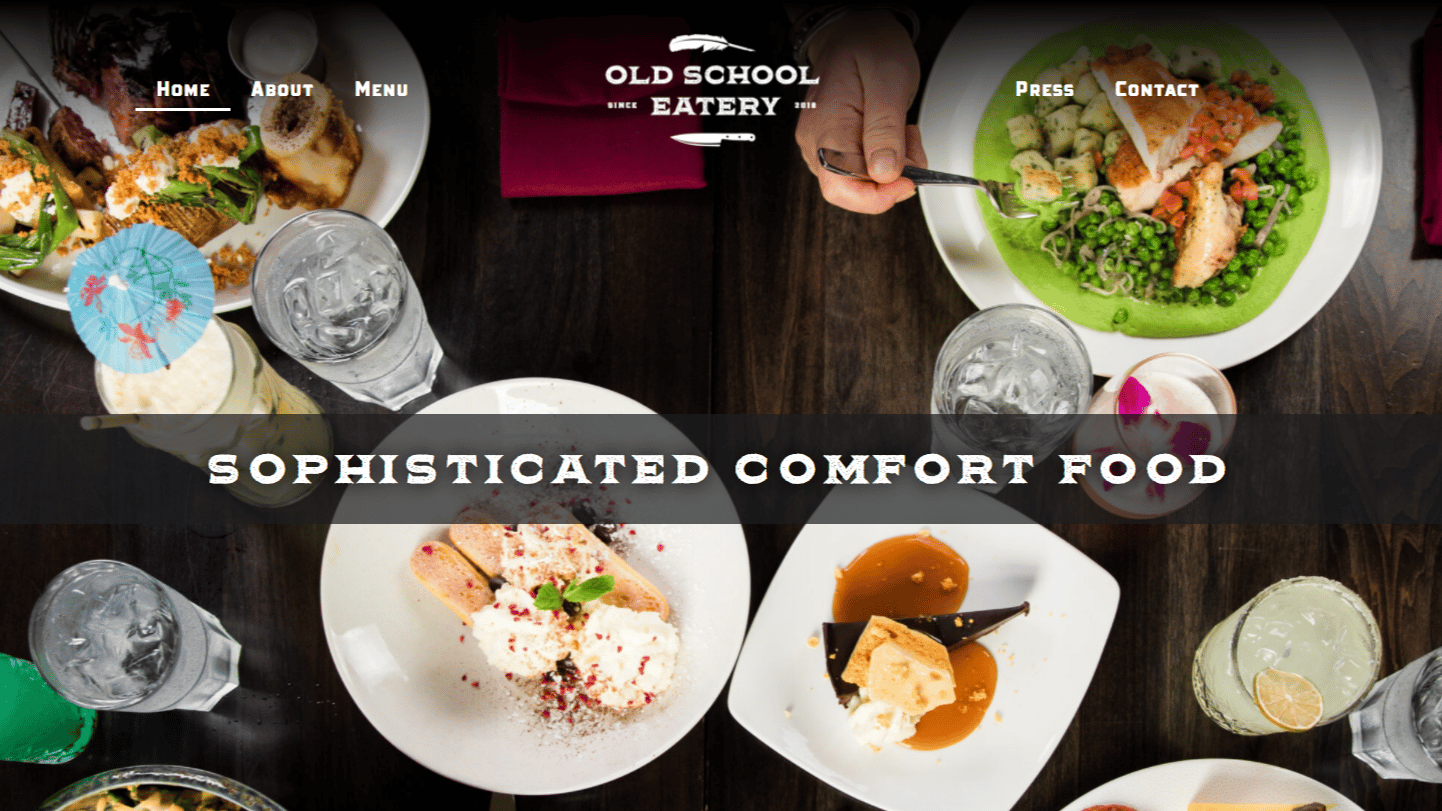 Home page of Old School Eatery with image of food and drinks on table